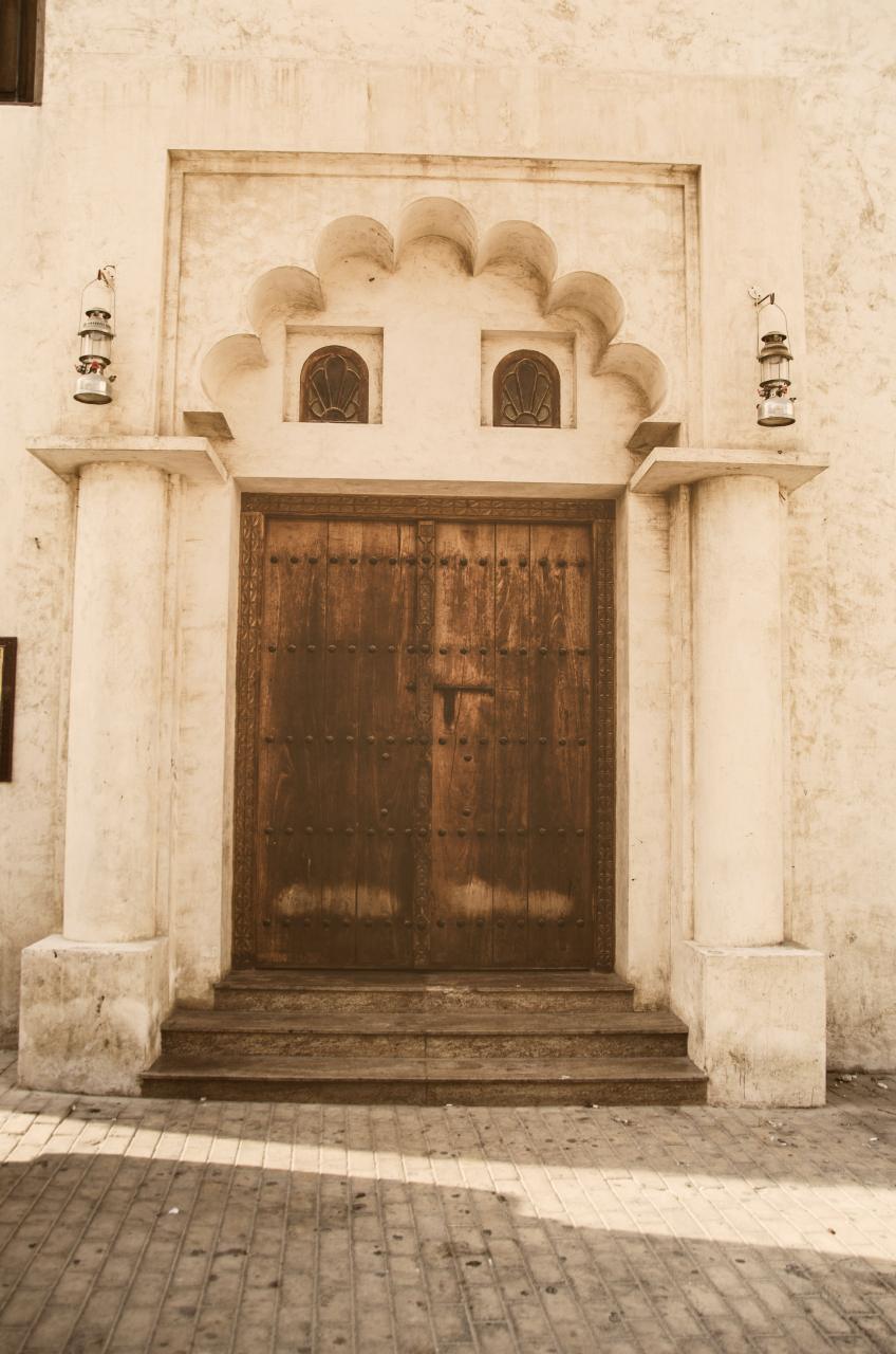 An old door in Sharjah, displaying the historical architecture of the city.