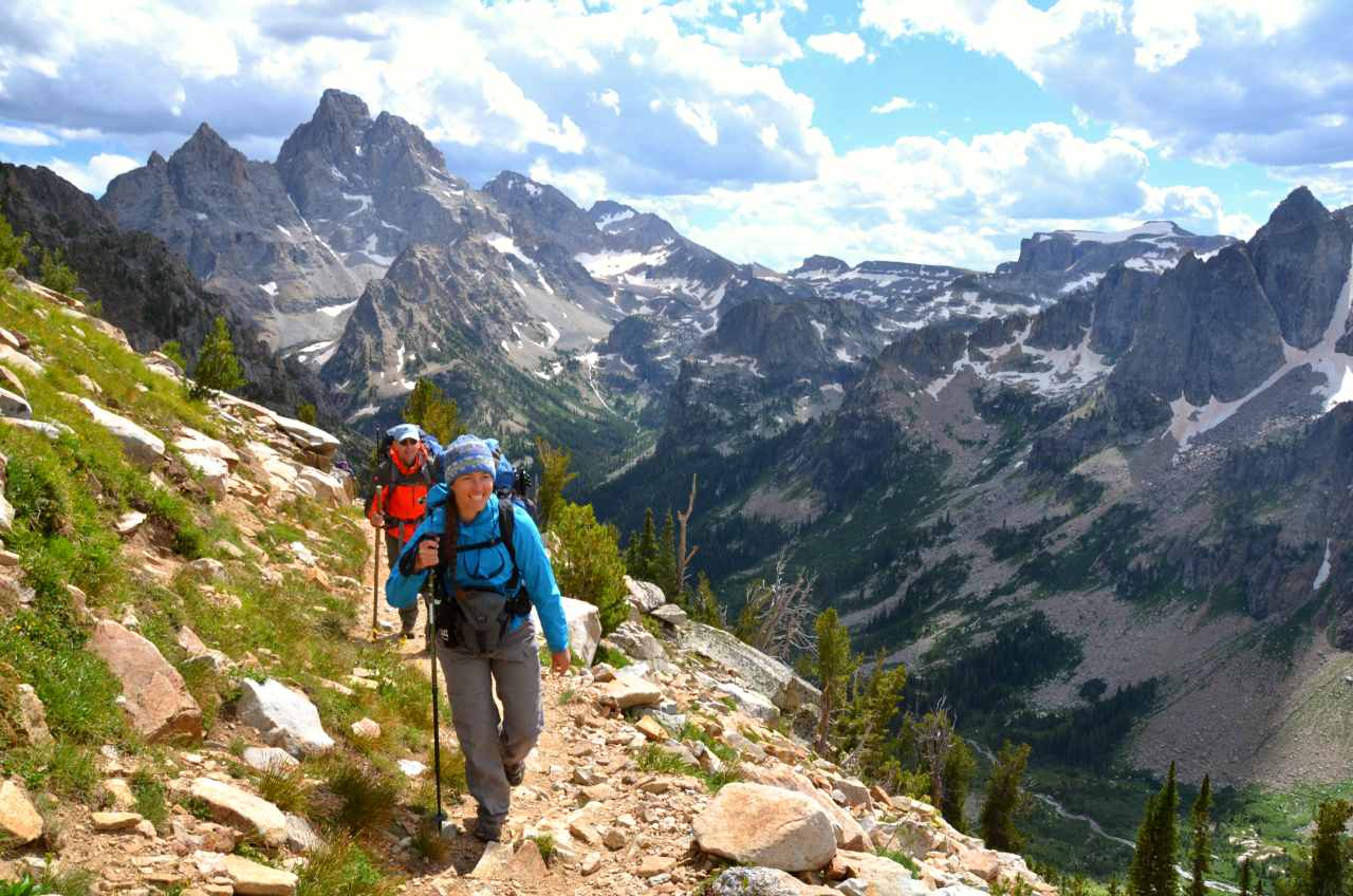 Two backpackers hiking through the mountains