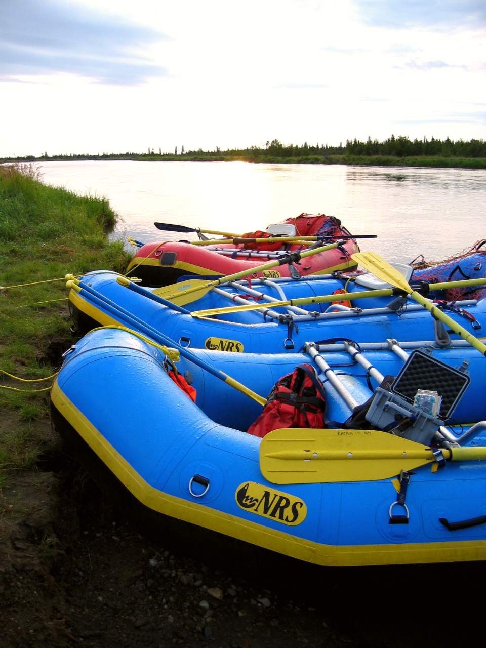 inflatable rafts on the edge of a river