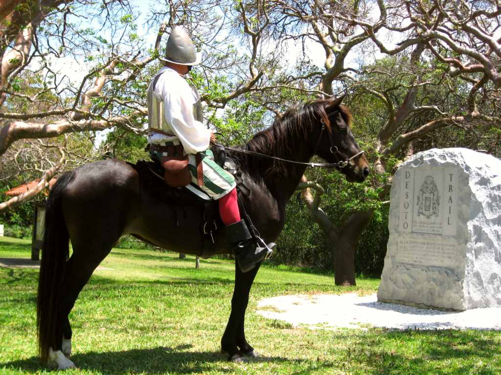 Reenactor Bill Boston on his horse Dixie in front of the De Soto Monument.