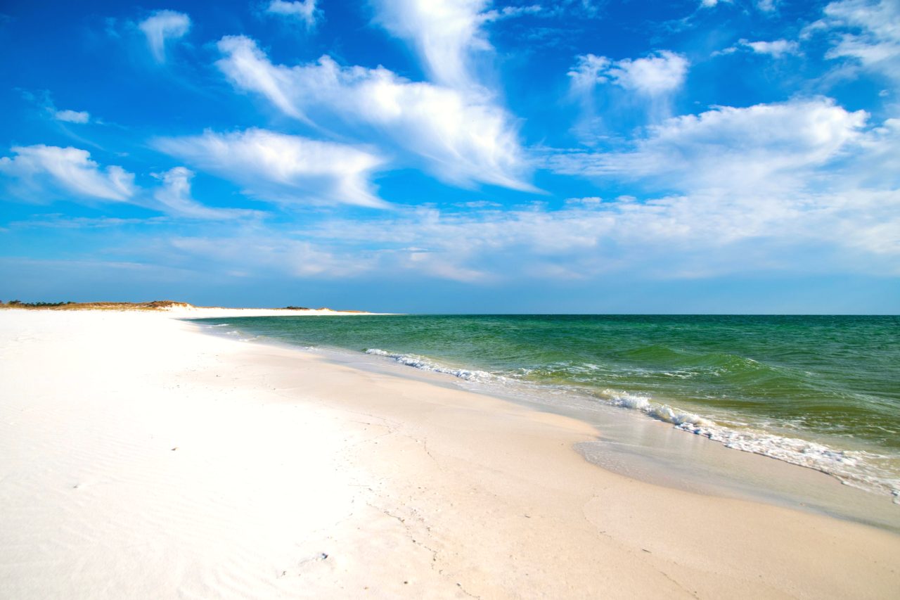 White sand and green water