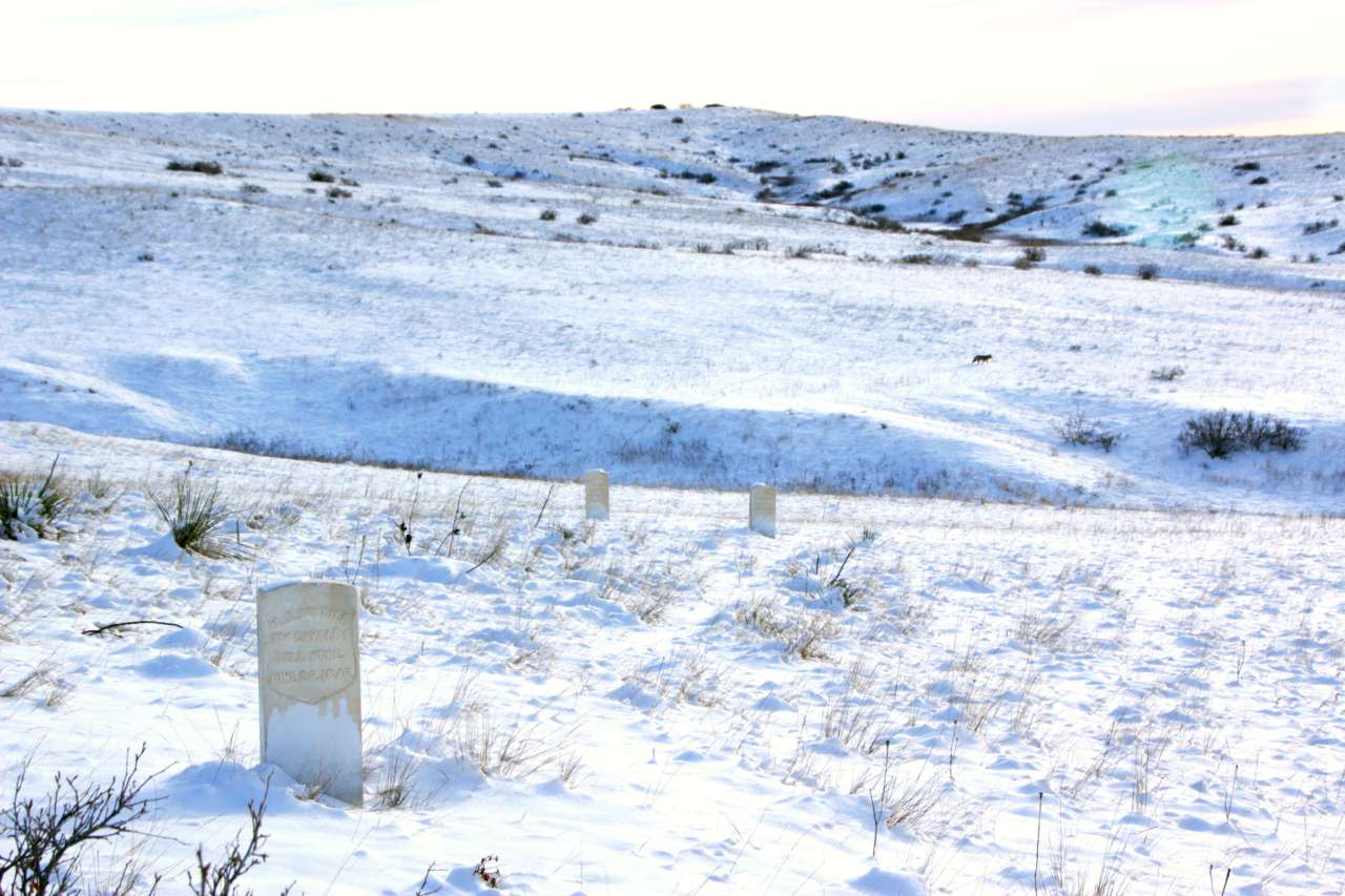 Headstone can still been seen even with the fresh snow that blankets the battlefield .