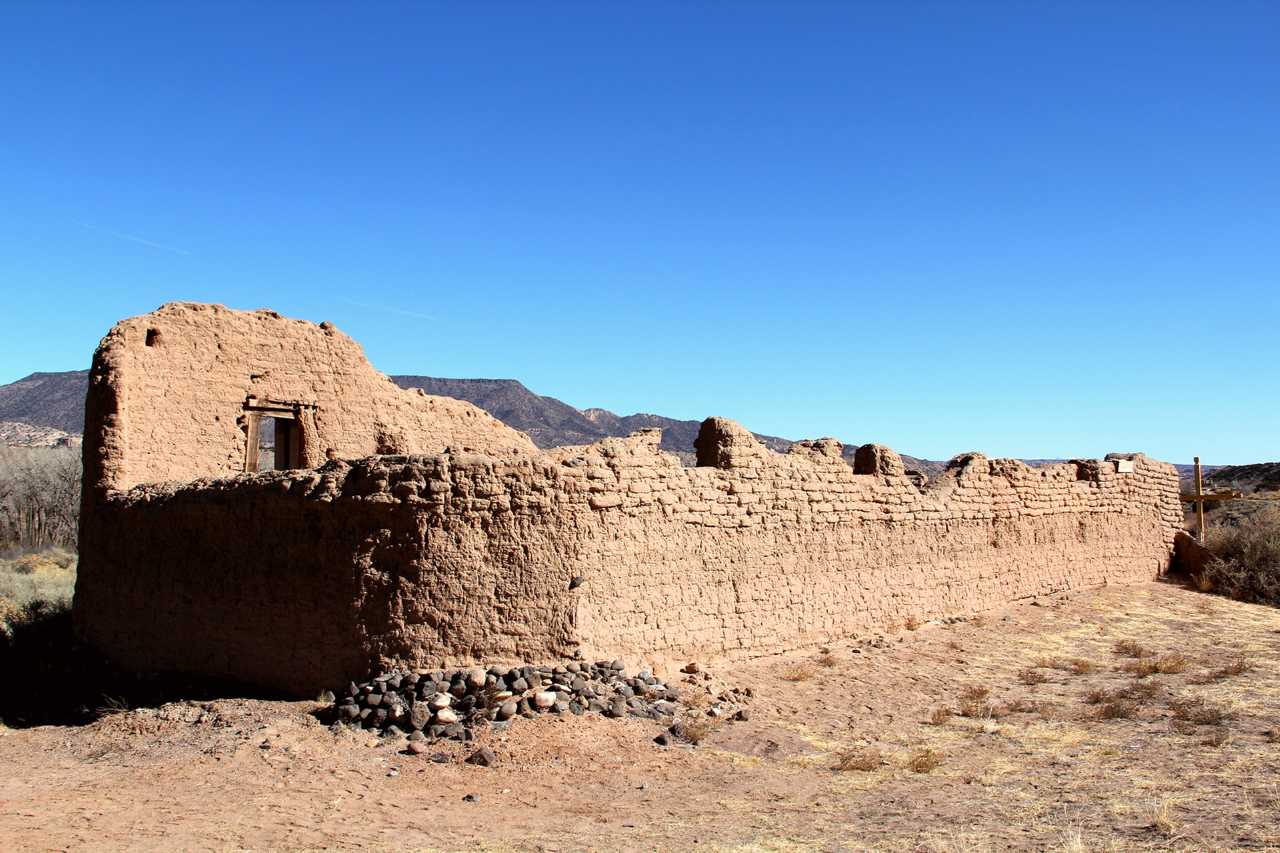 crumbling adobe structure with blue sky