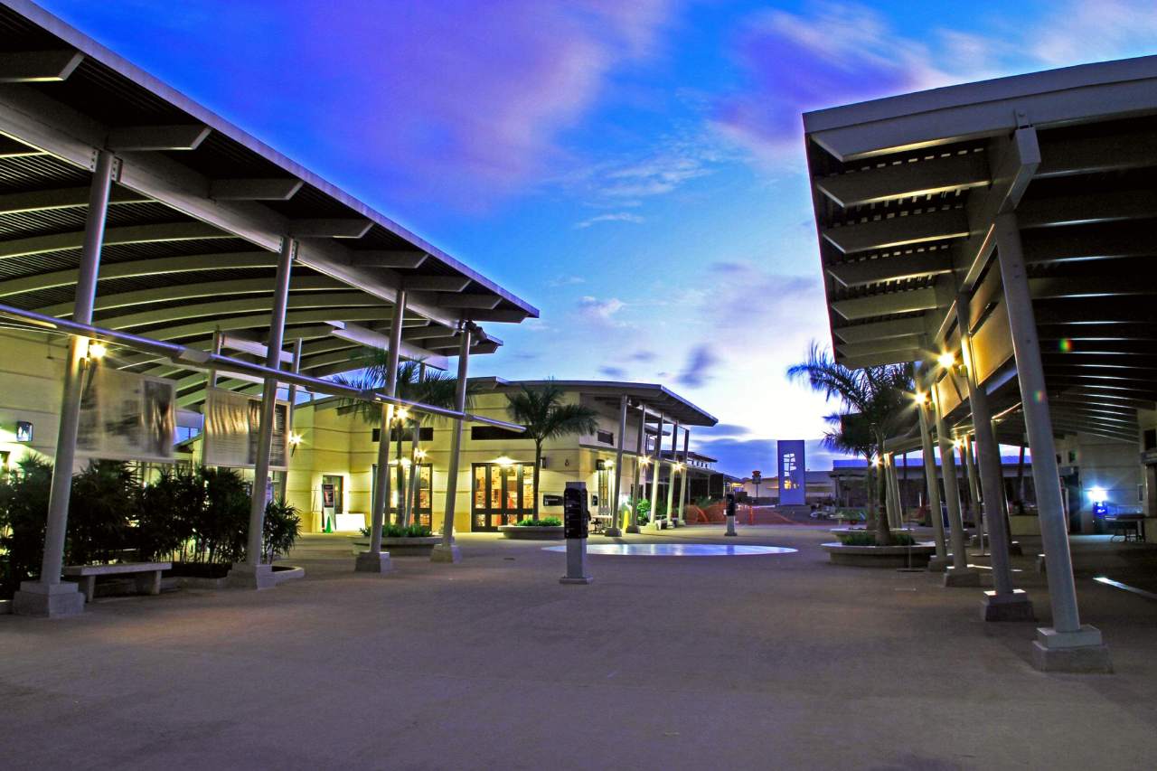 An evening photo of the Pearl Harbor Visitor Center Complex looking towards the museums.