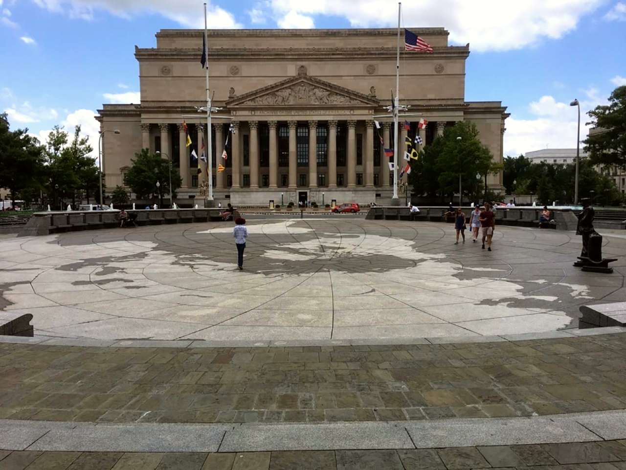 A stone plaza depicting a map of the globe.