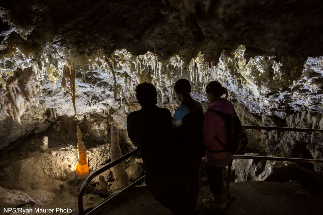 Visitors gaze at delicate cave formations in Timpanogos Cave's Chimes Chamber