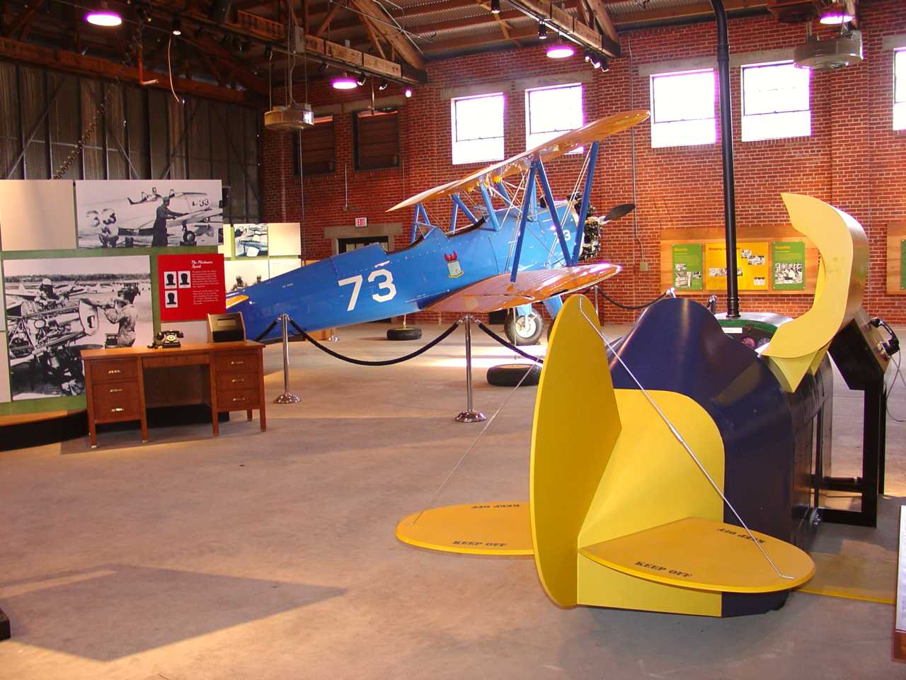 A World War II flight simulator and PT-17 bi-wing training plane