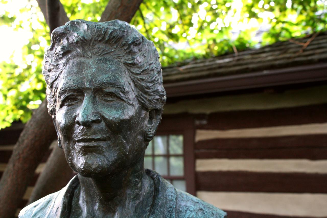 Bust of Catherine Filene Shouse with building in back