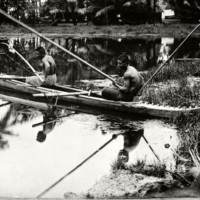 Two men fishing from canoe, 1914
