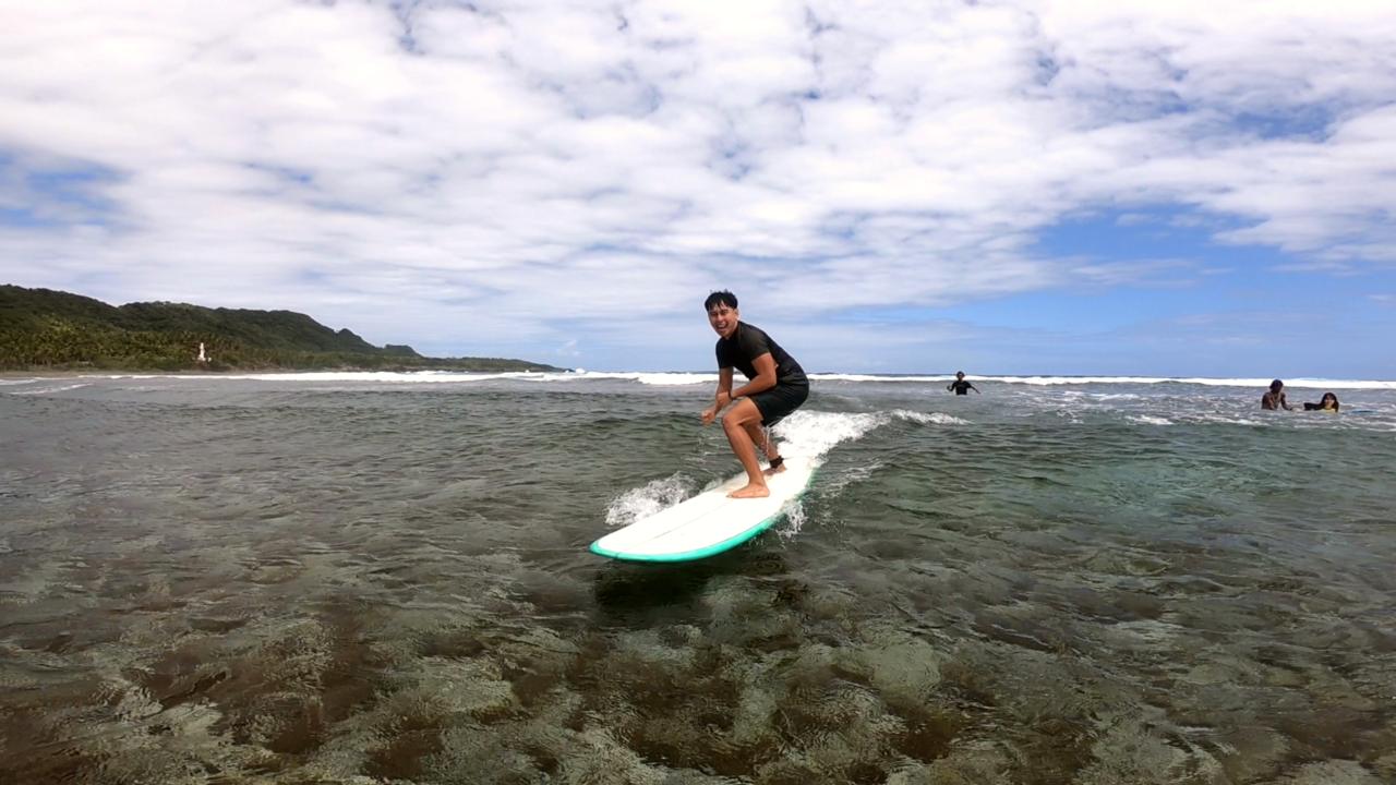 A beginner surfer in Siargao