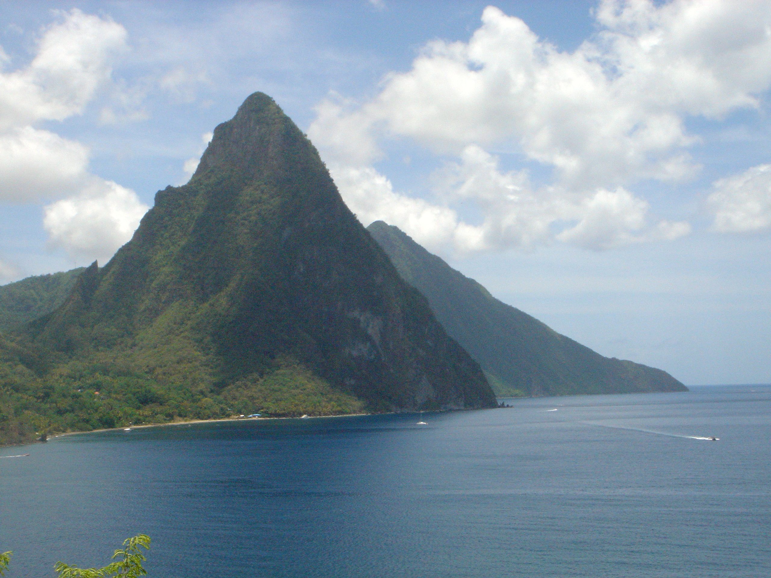 The iconic Pitons rise majestically above the sea