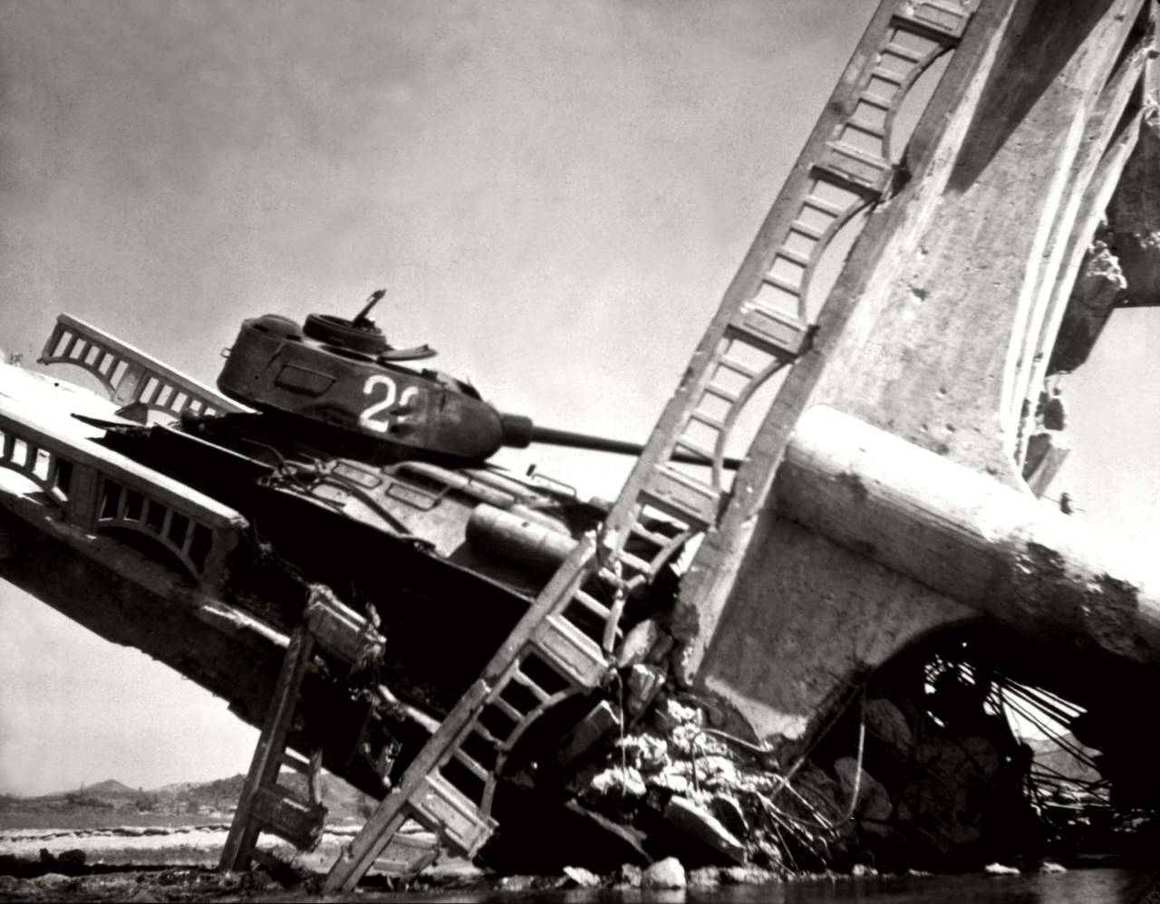 North Korean T-34-85 caught on a bridge south of Suwon by US attack aircraft in the Korean War