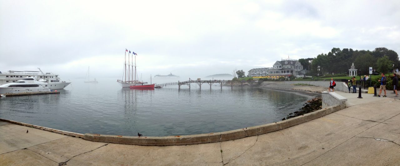 The four-masted schooner Margaret Todd. Bald Porcupine Island is beyond the pier and the Bar Harbor Inn is to the right.